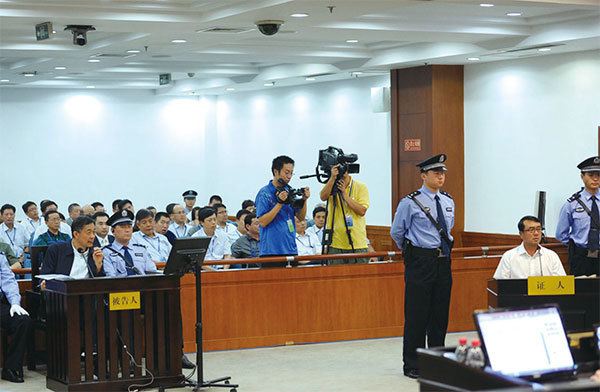 2013年8月24日薄熙來案審理第三天，薄的頭號打手王立軍出庭作證。（AFP）