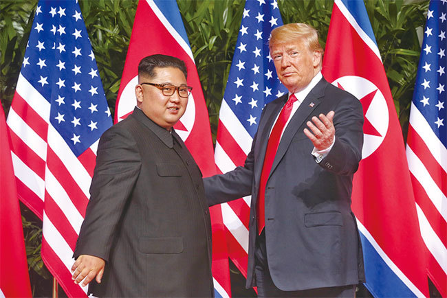 特朗普8月20日表示將與金正恩舉行第二次會晤，可能與習近平9月訪問北韓的傳聞有關。圖為6月12日特金會。（Getty Images）